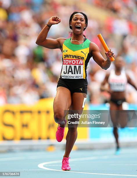 Shelly-Ann Fraser-Pryce of Jamaica crosses the line to win gold the Women's 4x100 metres final during Day Nine of the 14th IAAF World Athletics...