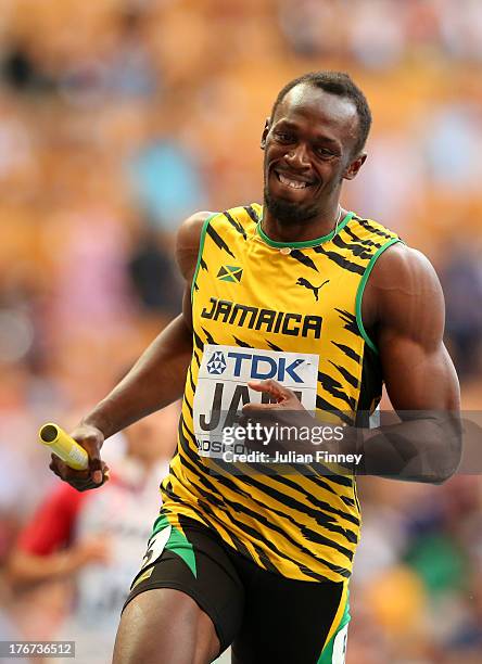 Usain Bolt of Jamaica crosses the line first win gold in the Men's 4x100 metres final during Day Nine of the 14th IAAF World Athletics Championships...