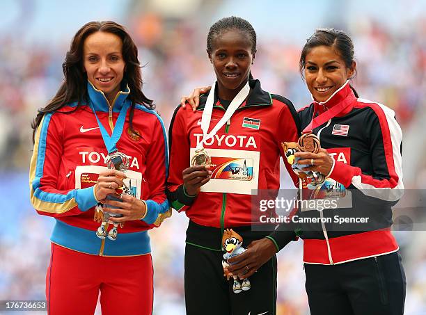 Silver medalist Mariya Savinova of Russia, gold medalist Eunice Jepkoech Sum of Kenya and bronze medalist Brenda Martinez of the United States stand...