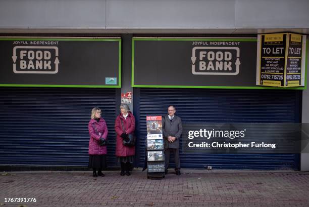 Jehovahs's Witnesses give out pamphlets outside a closed down food bank in Hanley on October 31, 2023 in Stoke on Trent, England Government figures...