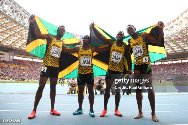 Gold medalists Nickel Ashmeade, Nesta Carter, Kemar Bailey-Cole, and Usain Bolt of Jamaica pose after the competes in the Men's 4x100 metres final...