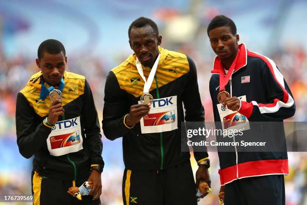 Silver medalist Warren Weir of Jamaica, gold medalist Usain Bolt of Jamaica and bronze medalist Curtis Mitchell of the United States stand on the...