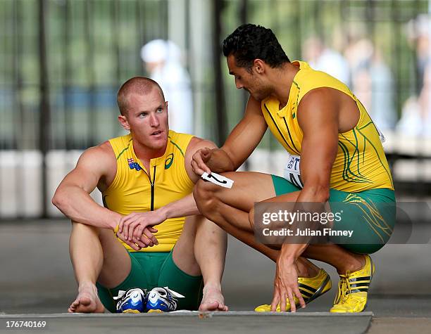 Joshua Ross and Andrew McCabe of Australia look despondent as they fail to finish their Men's 4x100 metres heat during Day Nine of the 14th IAAF...