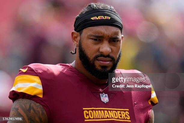 Montez Sweat of the Washington Commanders looks on during warmups before a game against the Philadelphia Eagles at FedExField on October 29, 2023 in...