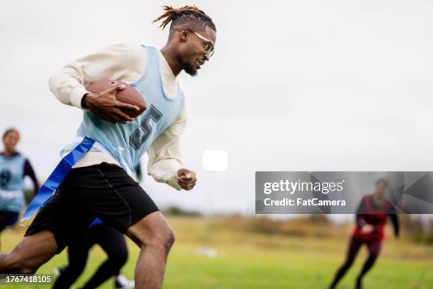 university flag football fun - flag football stock pictures, royalty-free photos & images