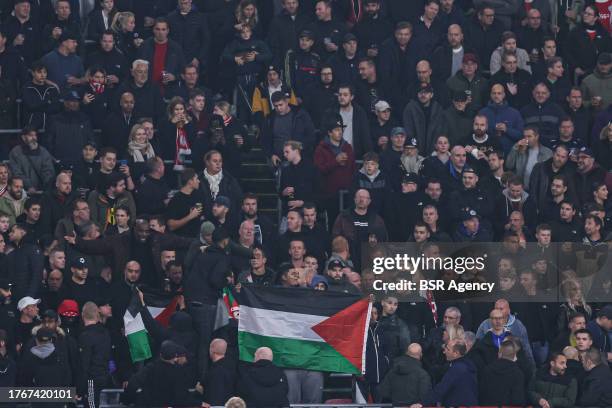 Fans with a Palestina flag during the Dutch Eredivisie match between Ajax and SC Heerenveen at Johan Cruijff ArenA on November 5, 2023 in Amsterdam,...