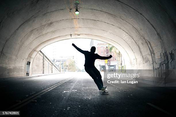 male skateboarding silhouette - skate stock pictures, royalty-free photos & images