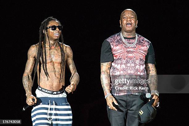 Rappers Lil Wayne and Birdman perform in concert as part of America's Most Wanted Tour at Austin360 Amphitheater on August 17, 2013 in Austin, Texas.