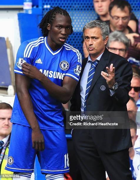 Chelsea manager Jose Mourinho talks to substitute Romelu Lukaku of Chelsea during the Barclays Premier League match between Chelsea and Hull City at...