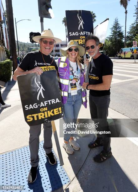Bryan Cranston, Jeri Ryan and Steven Weber join the picket line outside Warner Bros. Studios on October 31, 2023 in Burbank, California. SAG-AFTRA...