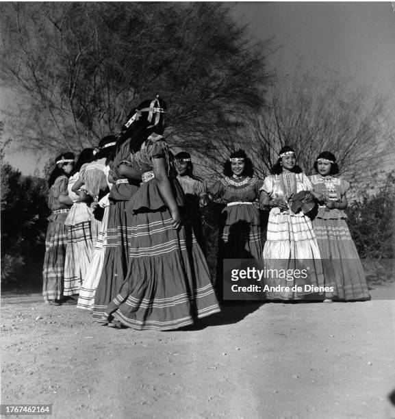 View of a group of dancers as they dance in a clearing, near Phoenix, Arizona, mid twentieth century.