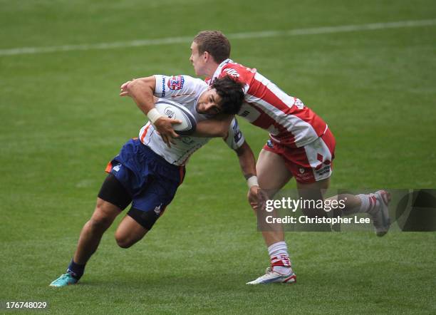 Nate Augspurger of New York holds off Steph Reynolds of Gloucester during the Plate Final match between Gloucester and New York in the World Club 7's...