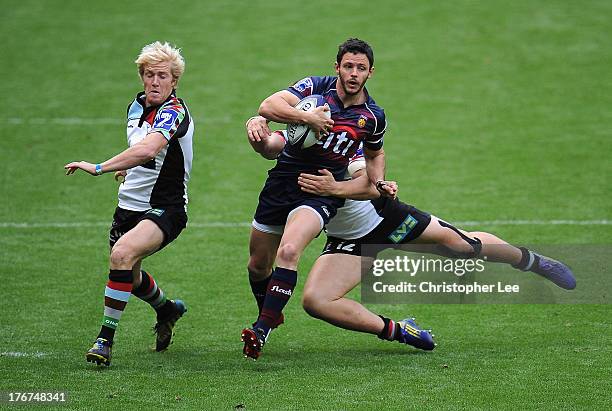 Gonzalo Gutuerrez Taboda of Buenos Aires gets away from Jack Clifford and Freddie Strange of Harlequins during the 3rd / 4th place match between...