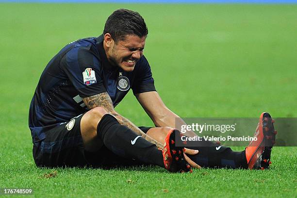 Mauro Icardi of FC Internazionale Milano lies injured on the ground during the TIM cup match between FC Internazionale Milano and AS Cittadella at...