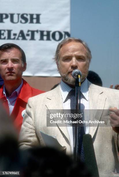 April 21: Governor Jerry Brown and actor Marlon Brando on stage at Dodger Stadium for an event to raise money Jesse Jackson's Rainbow PUSH Coalition...