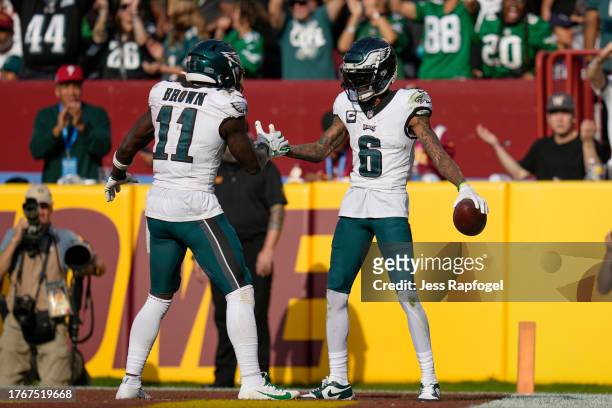 DeVonta Smith of the Philadelphia Eagles celebrates with A.J. Brown after scoring a touchdown against the Washington Commanders during the fourth...
