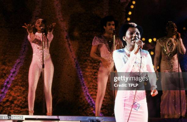 Jamaican singer Liz Mitchell is backed by Marcia Barrett, Bobby Farrell and Maizie Williams, of the German vocal group Boney M., during a concert in...