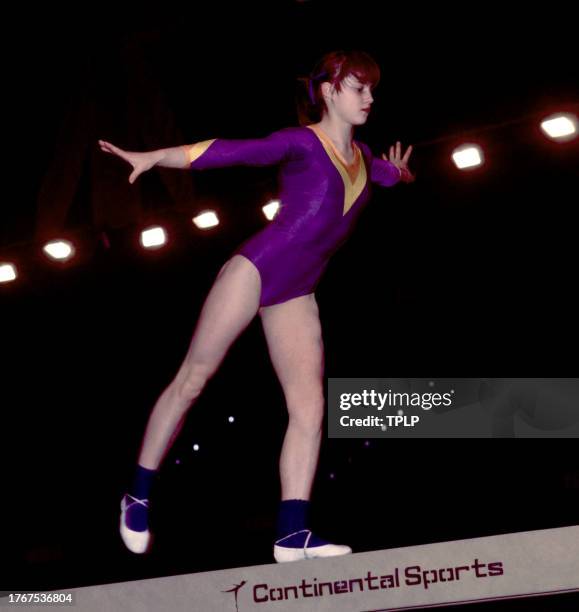 Romanian gymnast Nadia Comaneci competes on the balance beam in London, England, April 15, 1977. Comaneci was a five-time Olympic gold medalist, all...