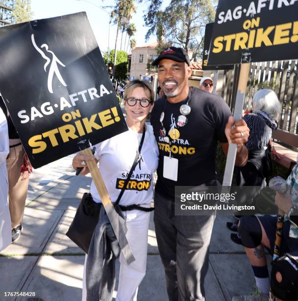 Gabrielle Carteris and Jason George join the picket line outside Warner Bros. Studios on October 31, 2023 in Burbank, California. SAG-AFTRA has been...