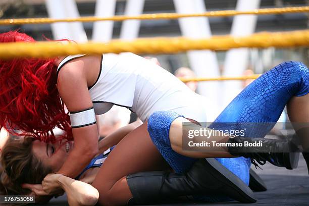 Wrestler/journalist Maria Menounos and WWE Diva Eva Marie attend the WWE and E!'s Total Divas take-over of SummerSlam held at Nokia Plaza L.A. LIVE...