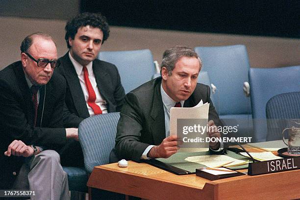 Israeli Ambassador to the United Nations Benjamin Netanyahu reads a report during his speech to the U.N. Security Council 14 January 1988. The...