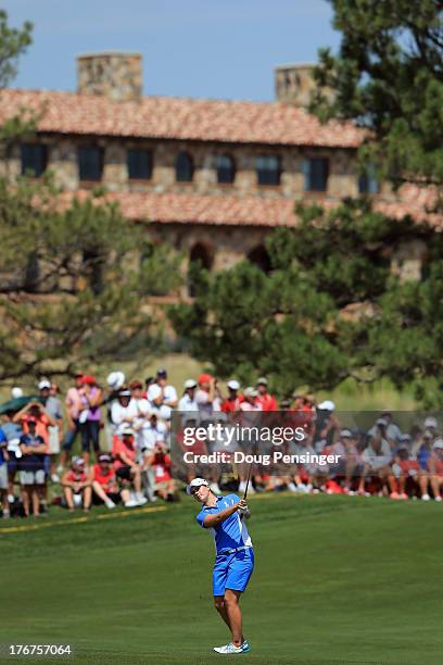 Caroline Masson of Germany and the European Team hits her third shot on the first hole during the final day singles matches of the 2013 Solheim Cup...