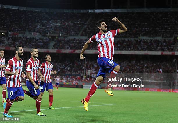 Diego Costa of Club Atletico de Madrid celebrates after scoring Atletico's opening goal during the La Liga match between Sevilla FC and Club Atletico...