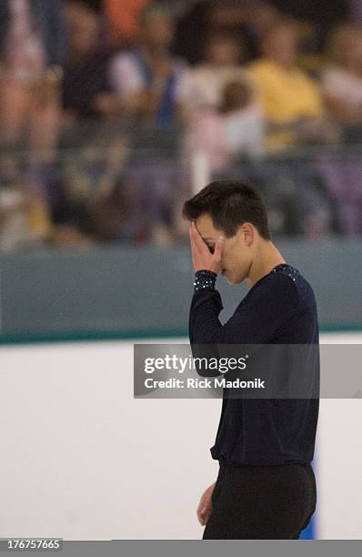 Patrick Chan doesn't appear all that happy with his routine after the finish at Skate Canada Summer Skate event in Thornhill, August 18, 2013. The...