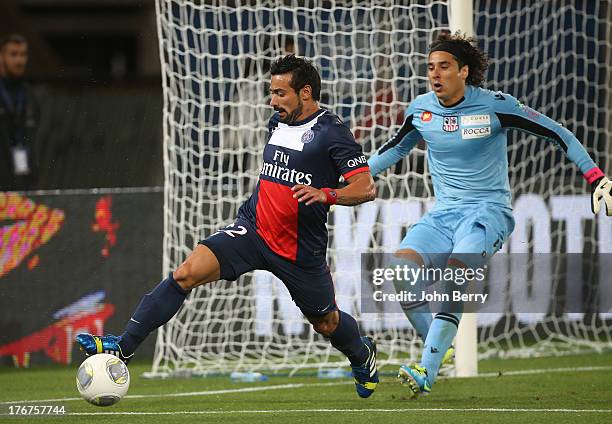 Ezequiel Lavezzi of PSG and Guillermo Ochoa, goalkeeper of AC Ajaccio in action during the Ligue 1 match between Paris Saint Germain FC and AC...