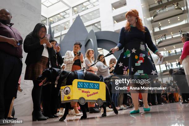 Dogs dressed in costume participate in the "BiPAWtisan Howloween" dog parade in the Hart Senate Office Building on October 31, 2023 in Washington,...