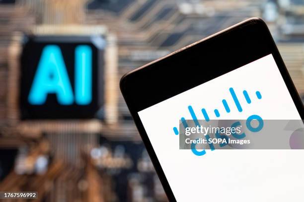 In this photo illustration, the American-based multinational digital communications technology conglomerate Cisco logo seen displayed on a smartphone...