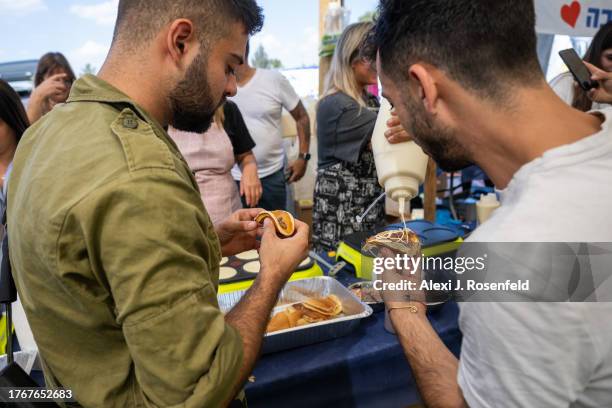 Volunteers make breakfast for soldiers at a rest stop on October 31, 2023 in Tel Aviv, Israel. As Israel's response to Hamas's Oct 7 attacks entered...