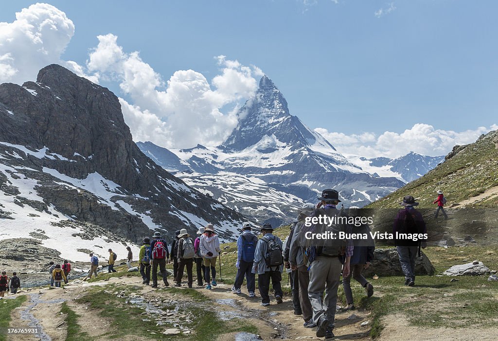 Tourists walking toward Matterhorn