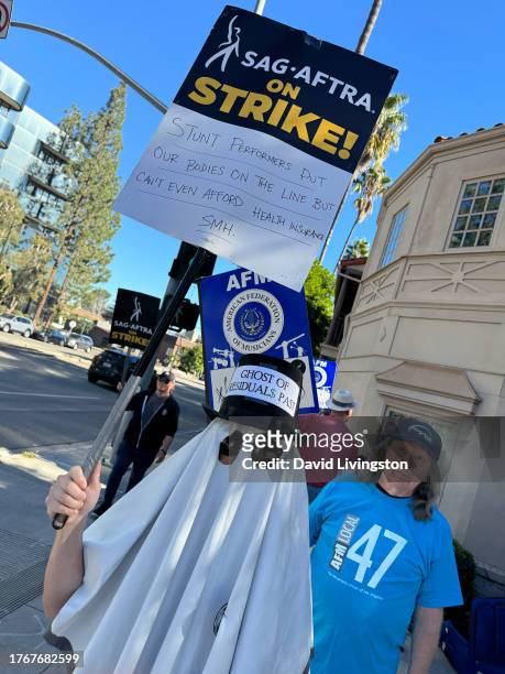 Protesters join the picket line outside Warner Bros. Studios on October 31, 2023 in Burbank, California. SAG-AFTRA has been on strike since July 14,...