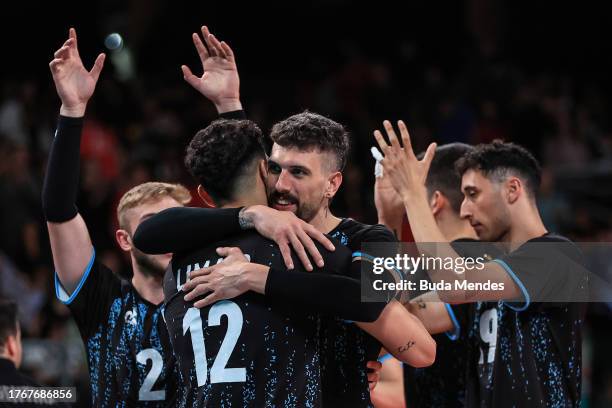 Players of Argentina celebrate the victory against Team Dominican Republic during the Volleyball - Men's Team Group B at Movistar Arena on Day 11 of...