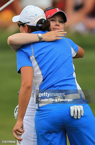 Carlota Ciganda of Spain and the European Team is congratulated by Morgan Pressel of the United States Team after Ciganda won their match 4&2 during...