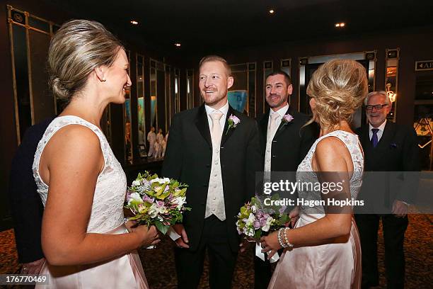 Trent Kandler talks to his matron of honour Tracey Moloney while husband-to-be Paul McCarthy and flower girl Amanda Wenham look on at the Museum...