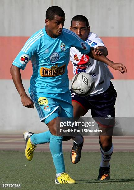 Nelinho Quina of Sporting Cristal fights for the ball with Giancarlo Carmona of Jose Galvez during a match between Jose Galvez and Sporting Cristal...