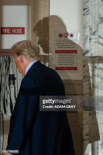 Former US President Donald Trump leaves for the lunch break at New York Supreme Court during his civil fraud trial in New York City, November 6,...