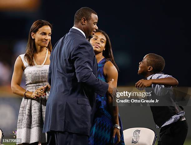 Former Mariners great, Ken Griffey Jr. Is greeted by members of his family including wife Melissa , daughter Taryn, and son Tevin during a ceremony...