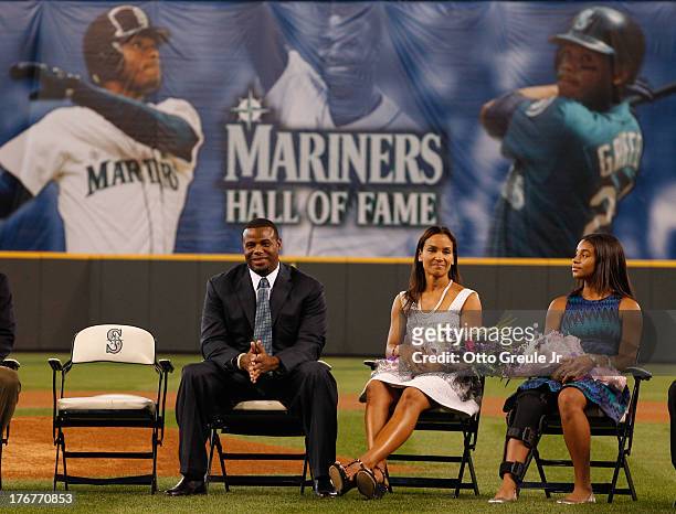 Former Mariners great, Ken Griffey Jr., wife Melissa, and daughter Taryn, look on during a ceremony inducting him into the Seattle Mariners Hall of...