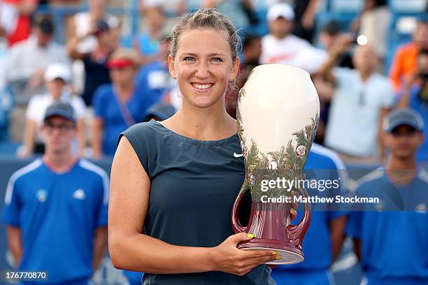 Victorioa Azarenka of Belarus poses for photographers at the trophy ceremony after defeating Serena Williams during the final of the Western &...