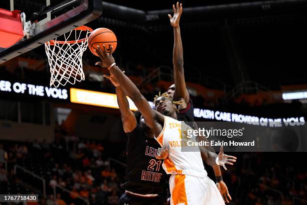 Jahmai Mashack of the Tennessee Volunteers attempts a basket against Chase Mebane and Percy Fyle of the Lenoir-Rhyne Bears in the first half at...