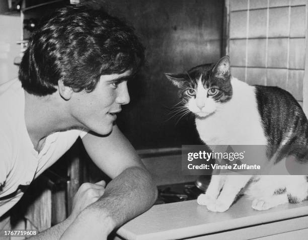 American actor Matt Dillon with his cat "Muffy", United States, circa 1970s.
