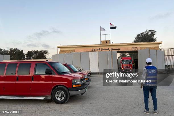 Cars of foreign embassies in Cairo await for foreign nationals to exit at Rafah border on November 6, 2023 in Rafah, Egypt. Since the outbreak of war...