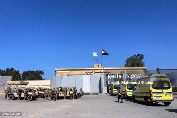Ambulances queue to cross the Rafah border from the Egyptian side to transport the injured from Gaza to receive treatment on November 6, 2023 in...