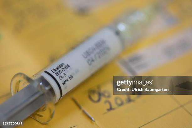 In this photo illustration a syringe with the flu vaccine Eflueld is seen with a vaccination certificate on November 06, 2023 in Bonn, Germany. The...