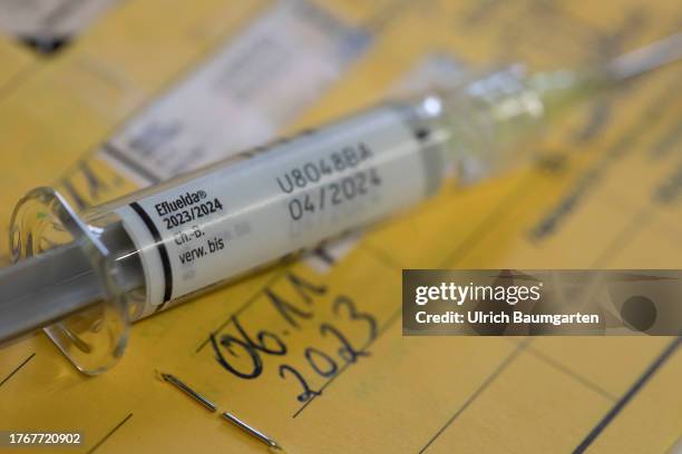 In this photo illustration a syringe with the flu vaccine Eflueld is seen with a vaccination certificate on November 06, 2023 in Bonn, Germany. The...