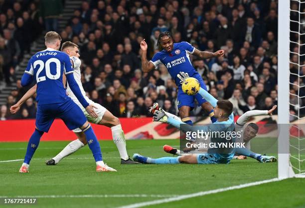Chelsea's English midfielder Raheem Sterling scores, but the goal is disallowed, during the English Premier League football match between Tottenham...
