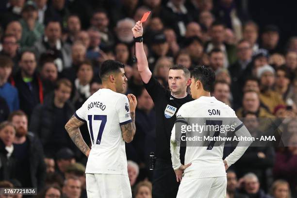 Cristian Romero of Tottenham Hotspur receives a red card from Referee Michael Oliver during the Premier League match between Tottenham Hotspur and...